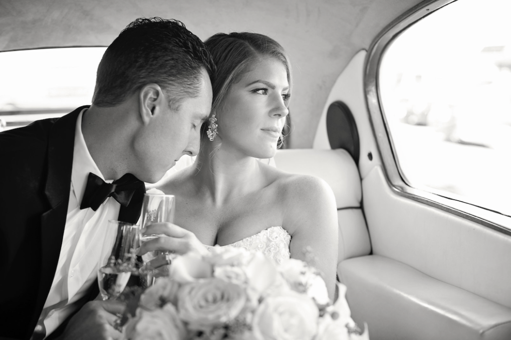 Bride and groom in car. Photo by Heyn Photography
